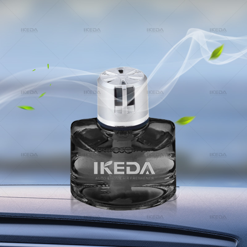 A row of transparent refill bottles for car perfume liquid on a production table.