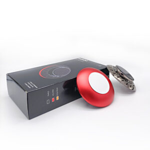 A black plastic vent clip air freshener with a rotatable head, attached to a car vent.